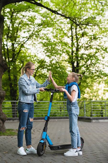When Girls Go Scootering, a Trail of Smiles Follows in Their Wake!